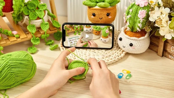 A beginner-friendly crochet kit featuring colorful yarn, crochet hook, stuffing, safety eyes, and instruction materials — laid out for making cute amigurumi-style animals.
