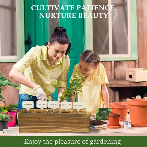 Mother and daughter planting bonsai seedlings outdoors with labeled pots and bonsai starter kit tools, enjoying gardening together.