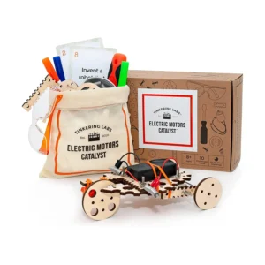 Tinkering Labs Electric Motors Catalyst kit with a drawstring bag, cards, tools, and a small motorized wooden car displayed in front of its box.