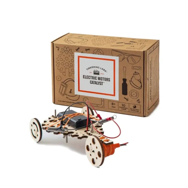 Wooden motorized car model built from the Electric Motors Catalyst kit, placed in front of its branded box.