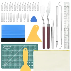 Polymer clay sculpting kit including precision tools, measuring mat, tweezers, spatulas, and extra blades.
