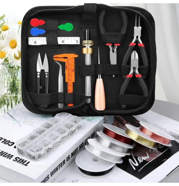 Jewelry making toolkit with pliers, wire spools, small parts organizer, and precision tools displayed on a floral background.