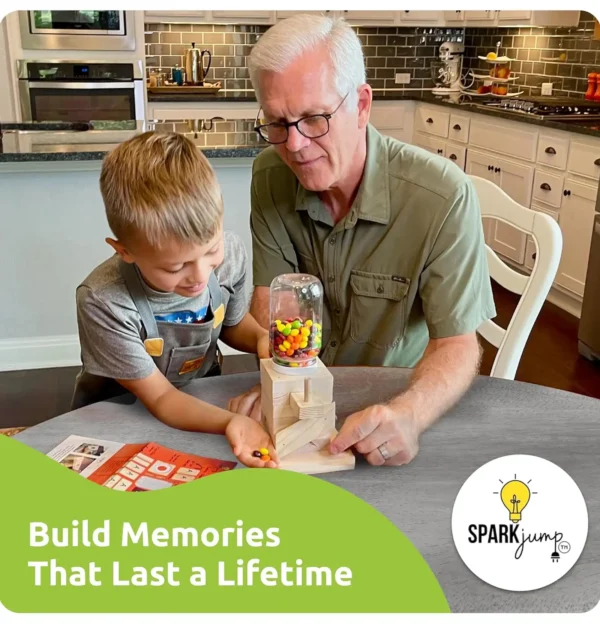 A grandfather and grandson playing with their handmade gumball machine in a home kitchen.