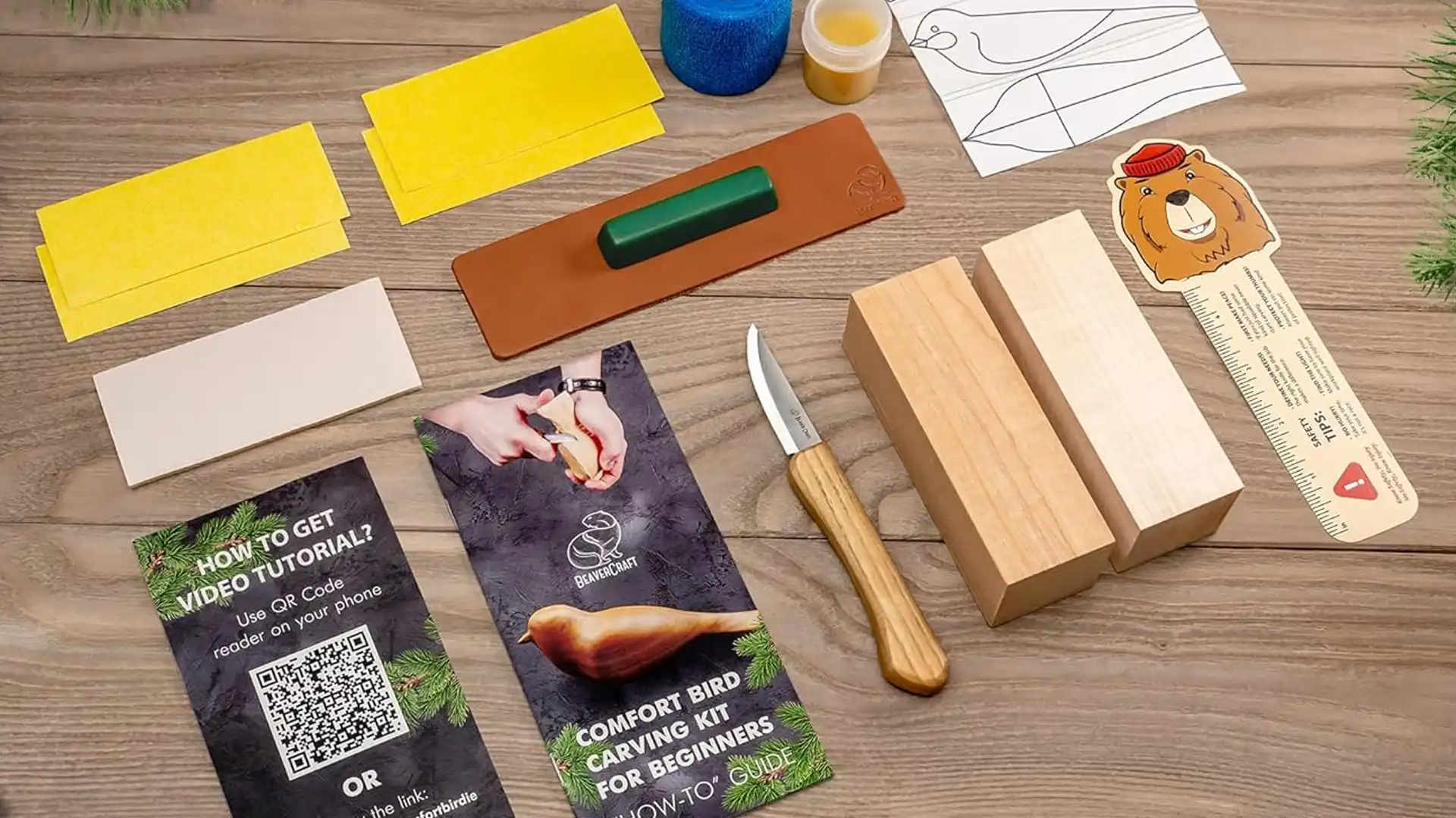 A wood carving starter kit featuring a sharp carving knife, basswood blocks, cut-resistant gloves, a sharpening tool, and a step-by-step guide, arranged on a wooden workspace.